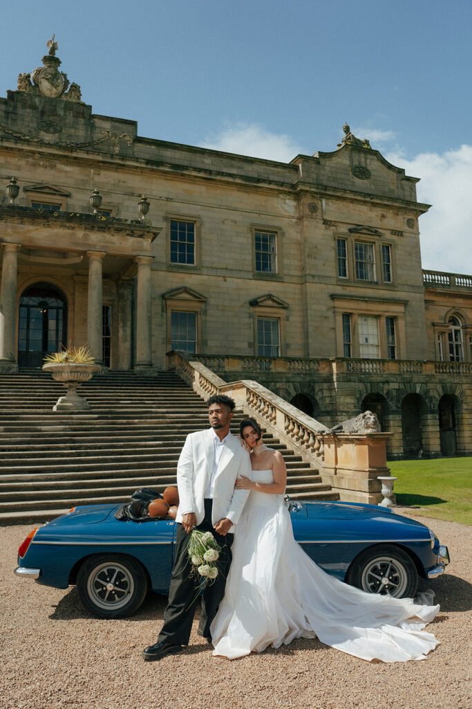 Bride laughing with bridesmaids in matching robes during getting ready at Gosford House