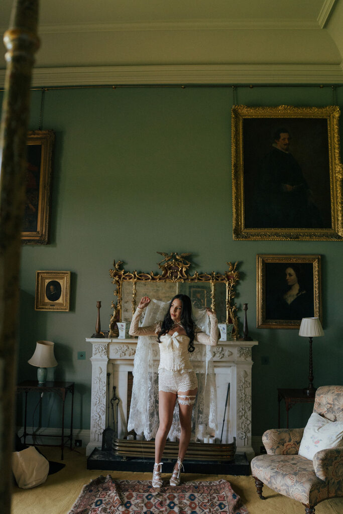 Mother of bride buttoning wedding dress editorial getting ready moment Gosford House Scotland