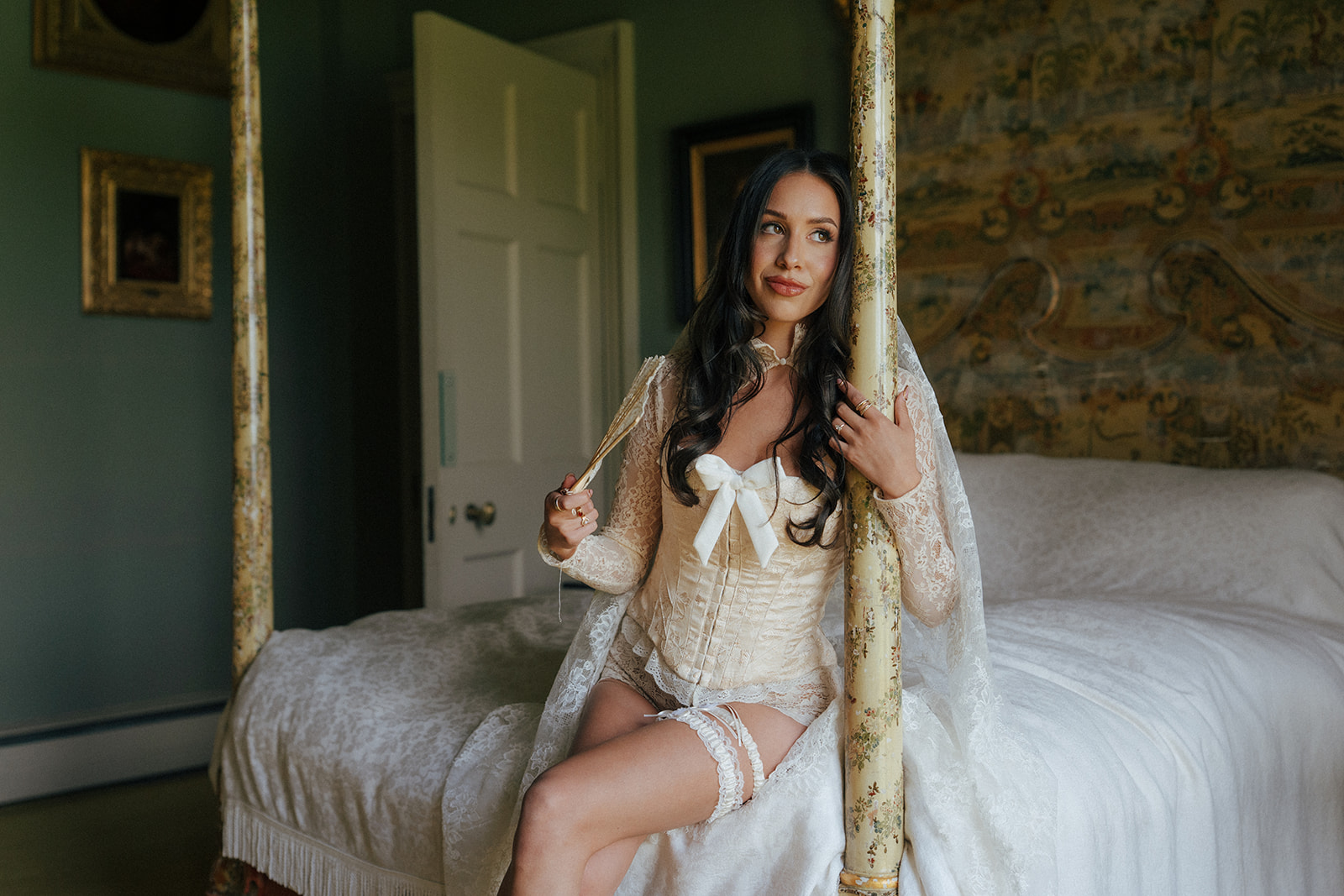 Bride looking in mirror while getting ready editorial style wedding photo at Gosford House