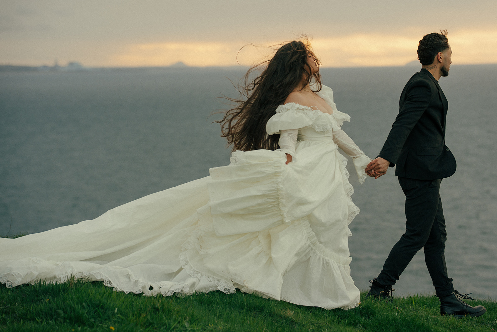 Overhead view of couple on Fast Castle cliffs elopement photos Edinburgh Scotland unique perspective