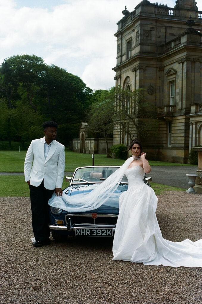 Bride and groom walking away at twilight at Gosford House Scotland wedding